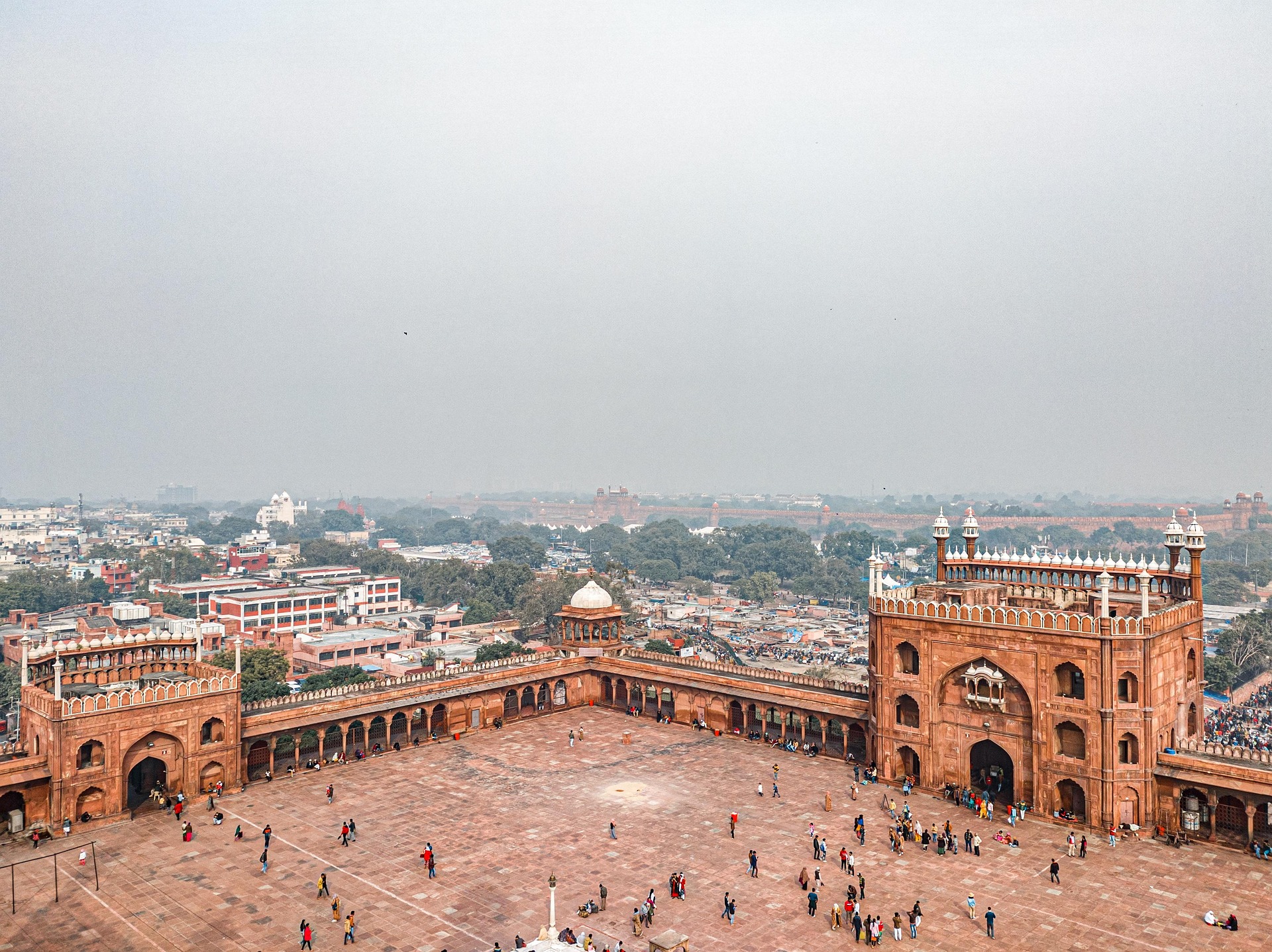 Aerial view of Jama Masjid and bustling Chandni Chowk market in Old Delhi, India.