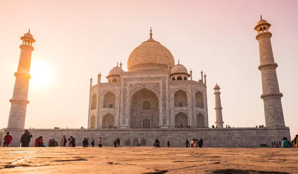2 weeks in India – Perfect Itinerary and Travel Blog Sunrise view of the Taj Mahal with golden light reflecting on white marble during 2-week India tour.